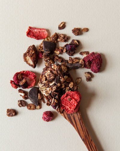 Granola Dark with Red Fruits on spoon